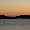 Wilderness rangers paddle down Ensign Lake in the BWCAW