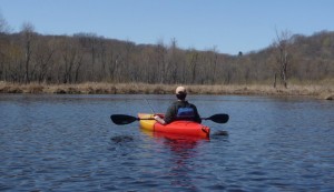     Gabe drifts with the current, scoping for elusive spring top-water fly fishing opportunities.