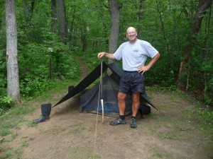 Bill Nedderman and his tarp shelter. Bill Nedderman and his tarp shelter.