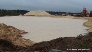 A settling pond at the Grantsburg mine, photo taken before the containment berm failed. A settling pond at the Grantsburg mine, photo taken before the containment berm failed.